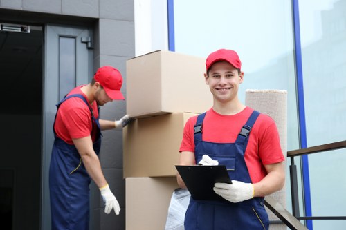 Professional movers assisting with an apartment relocation in Brompton