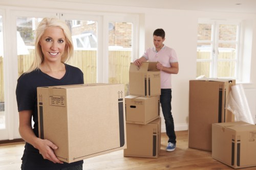 Local movers handling furniture in a Brompton residential street