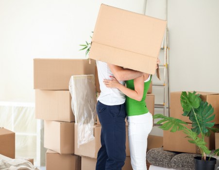 Business move preparation with labelled boxes and office furnishings