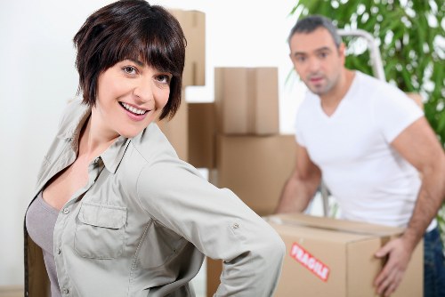 Local movers handling furniture in a Brompton home